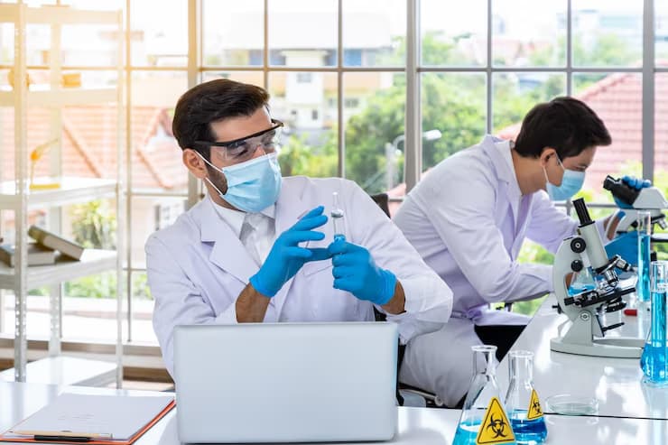 Scientists working in laboratory